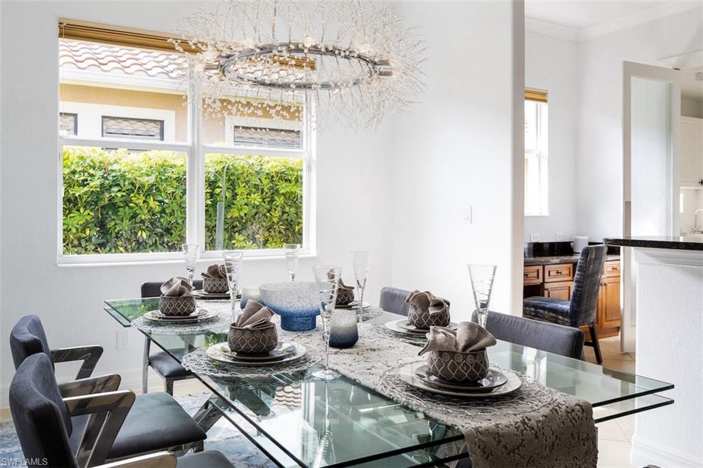 982 Tivoli Court Naples, FL 34104 - Photo 17 of 40 a kitchen with a stove a sink and cabinets