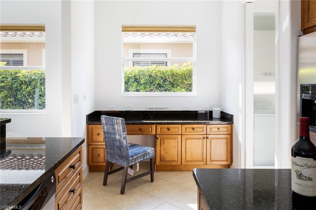 982 Tivoli Court Naples, FL 34104 - Photo 19 of 40 a room with furniture and a window