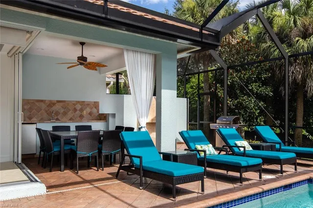 a outdoor living space with furniture and a fireplace