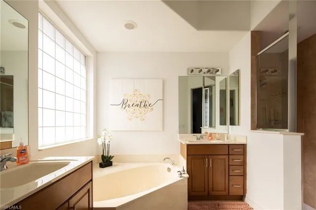 a bedroom with a bed and a mirror