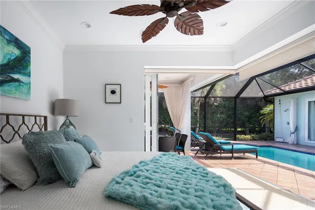 a bed room with a bed and a painting on the wall