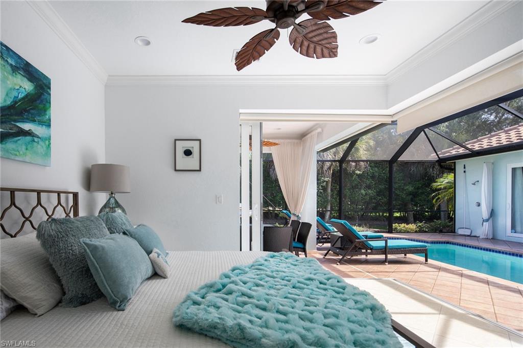 982 Tivoli Court Naples, FL 34104 - Photo 30 of 40 a bedroom with furniture and a large window