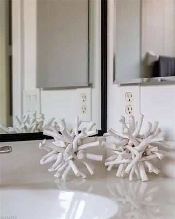 a bedroom with a bed and a lamp