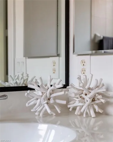 a bedroom with a bed and a lamp