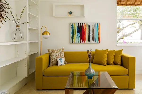 a living room with furniture and white walls