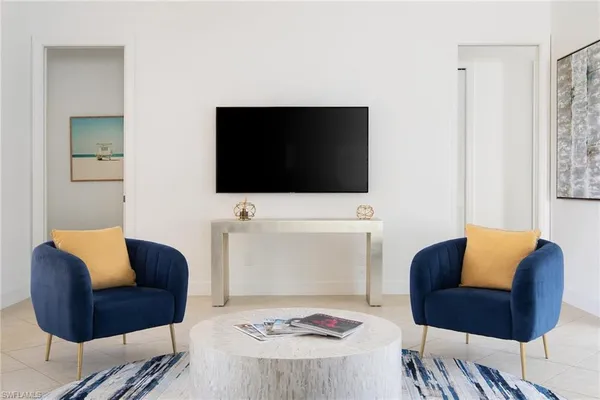a living room with furniture and a flat screen tv