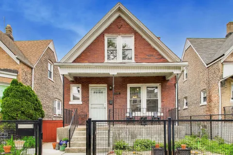 front view of a house with a small yard