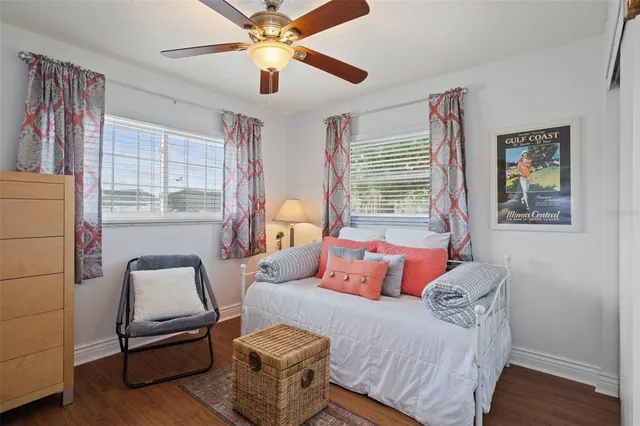 a living room with furniture and next to a window