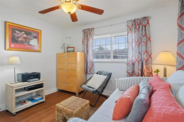 a kitchen with sink and view of living room