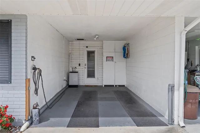 a potted plant sitting in front of a door