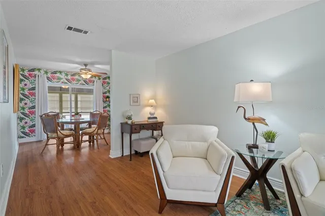 a view of a dining room with furniture window and wooden floor