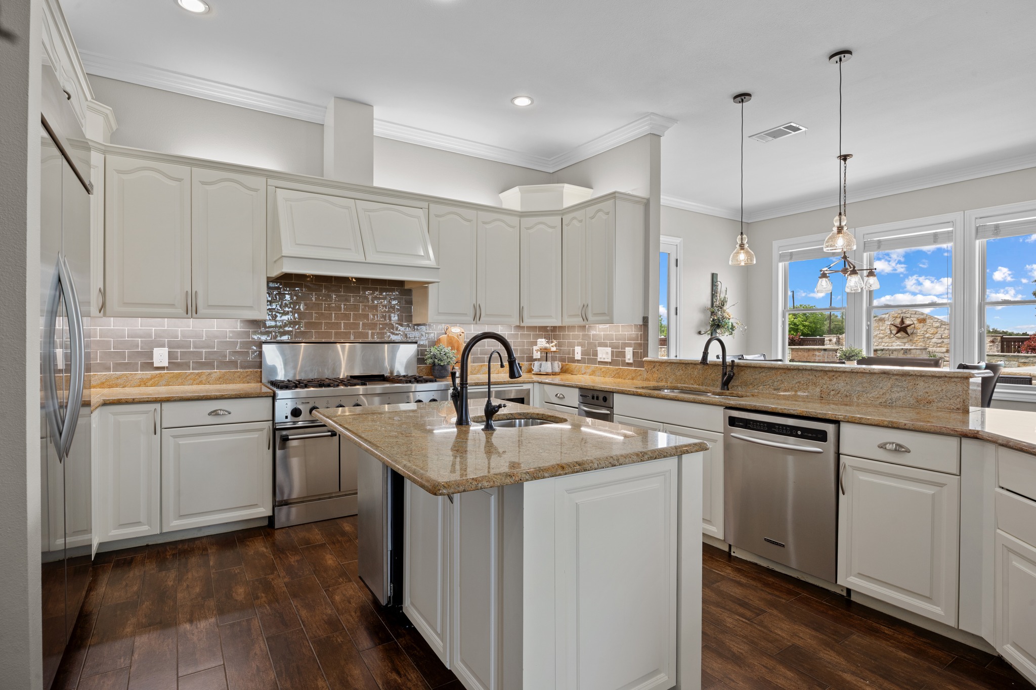 341 Courtnee's Way Georgetown, TX 78626 - Photo 12 of 40 Aspiring chefs and frequent hosts will fall in love with this expansive kitchen.