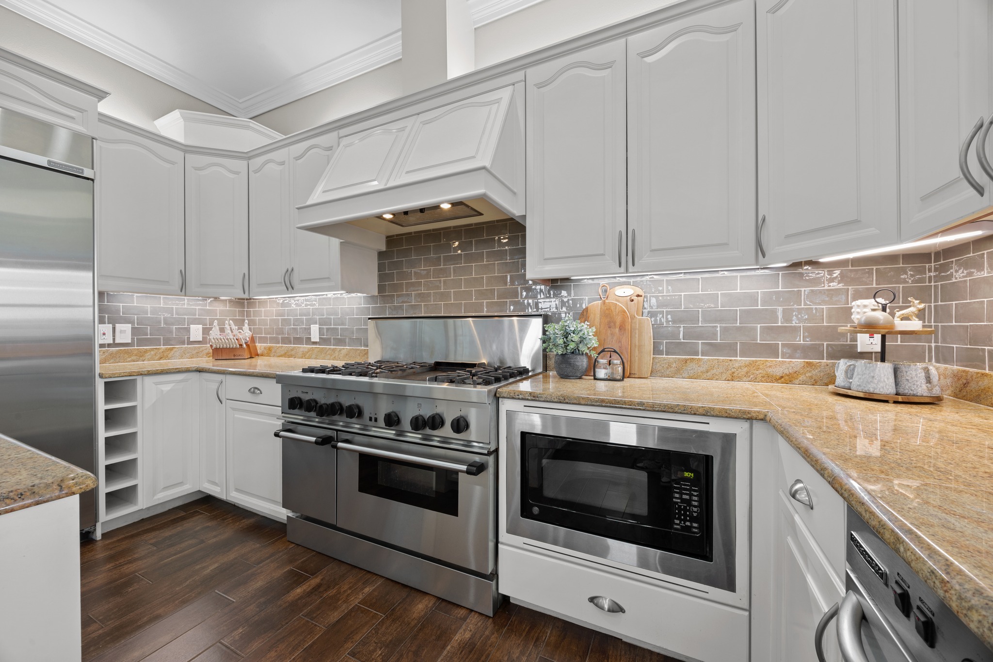 341 Courtnee's Way Georgetown, TX 78626 - Photo 13 of 40 The kitchen is a chefs dream with a Thermador six-burner range, a 48-inch refrigerator and custom cabinetry.