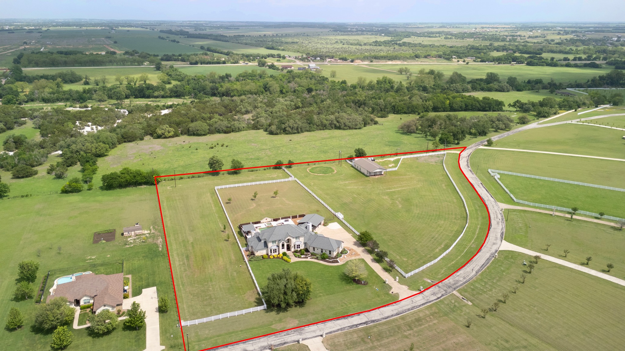 341 Courtnee's Way Georgetown, TX 78626 - Photo 2 of 40 A 2100 square foot barn has 3 horse stalls, tack room and plenty of storage room available.