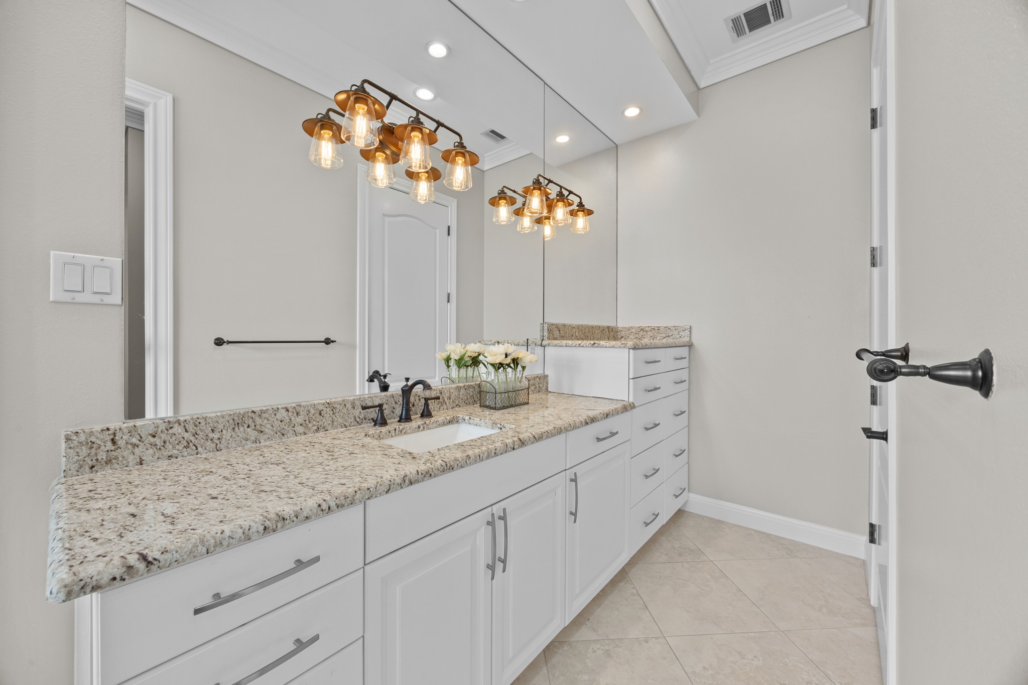 341 Courtnee's Way Georgetown, TX 78626 - Photo 23 of 40 Long granite-topped vanities provide an abundance of storage and counter space.