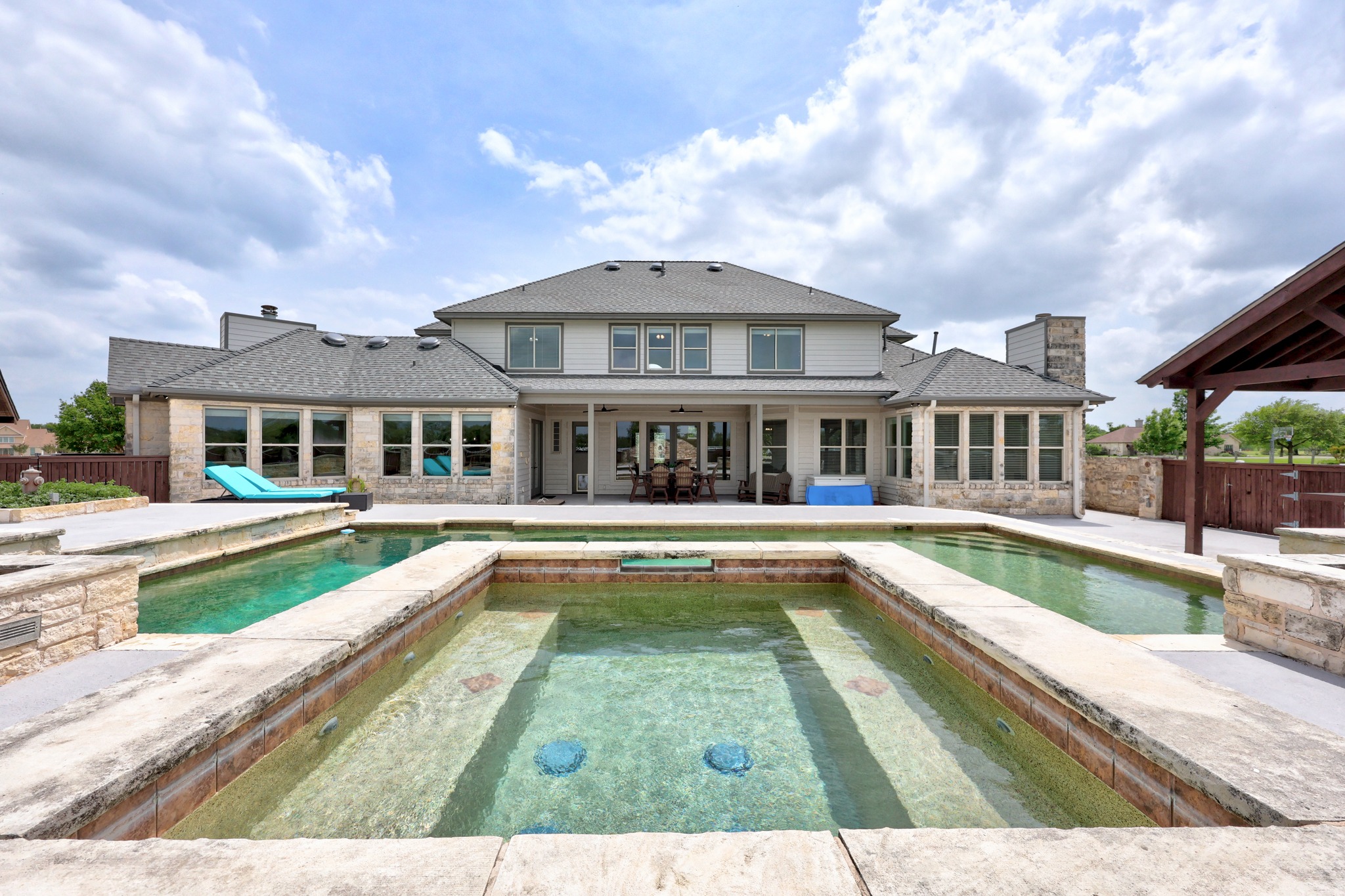 341 Courtnee's Way Georgetown, TX 78626 - Photo 33 of 40 Transform every weekend into a vacation with a backyard designed for ultimate relaxation and grand-scale entertaining.