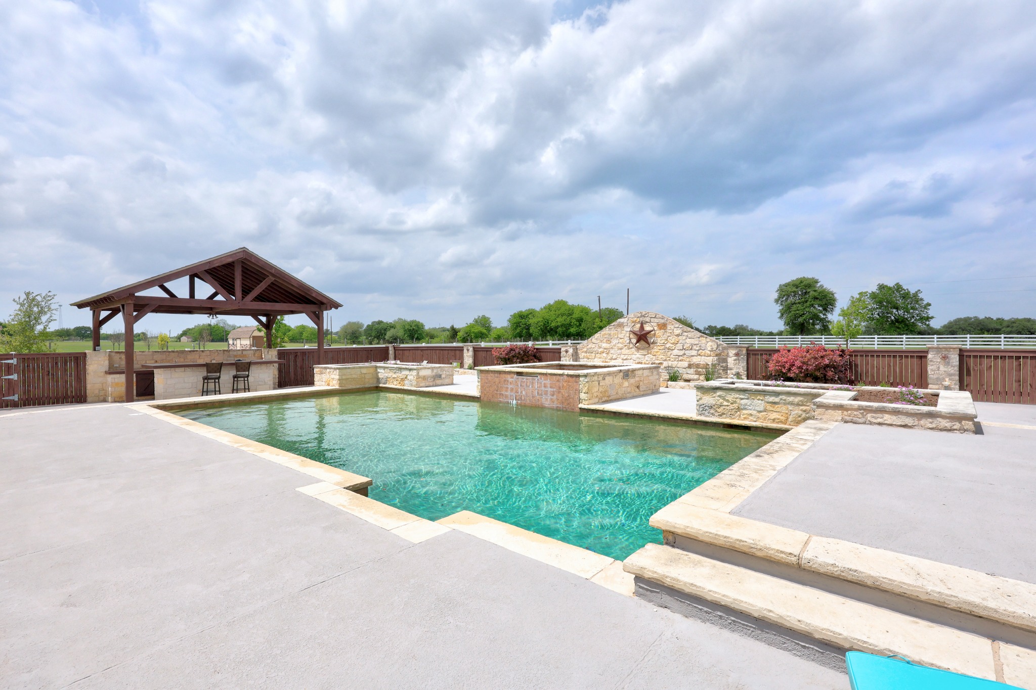 341 Courtnee's Way Georgetown, TX 78626 - Photo 35 of 40 New fencing surrounds the pool area for additional privacy.