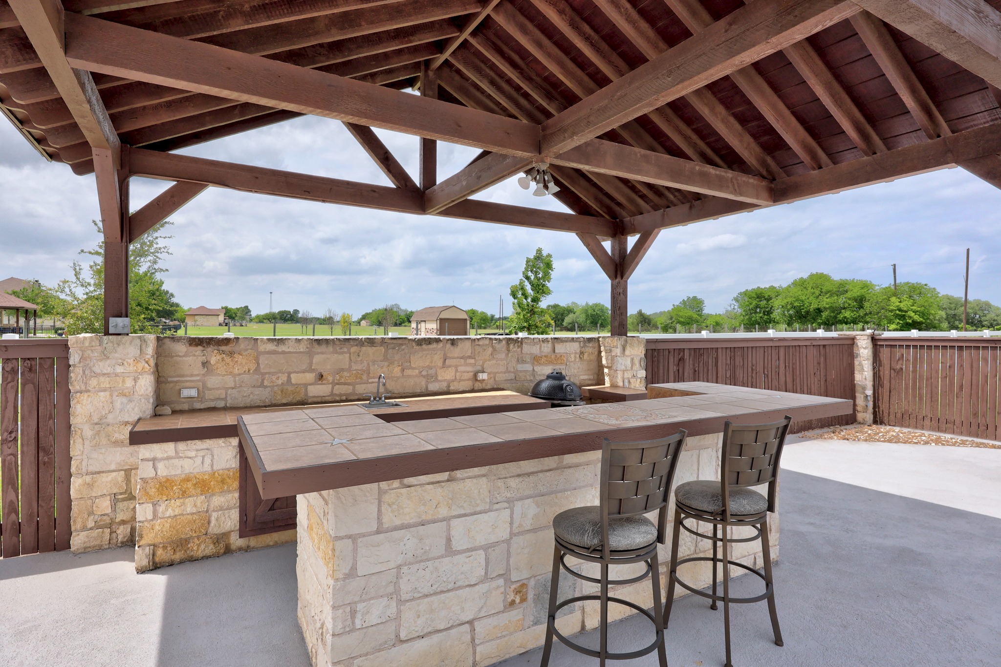 341 Courtnee's Way Georgetown, TX 78626 - Photo 36 of 40 The outdoor kitchen area has room to add a grill and seating to eat at the bar.
