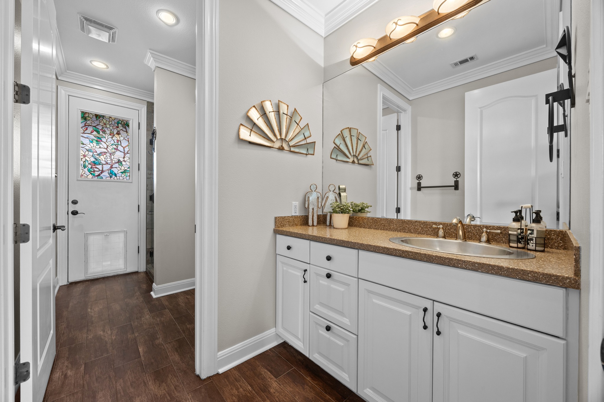 341 Courtnee's Way Georgetown, TX 78626 - Photo 8 of 40 The second bathroom downstairs has direct access to the patio and pool.