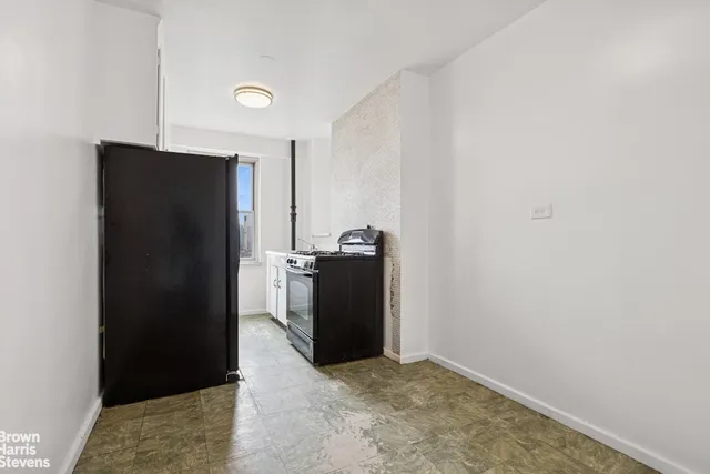 a bathroom with a sink and a window