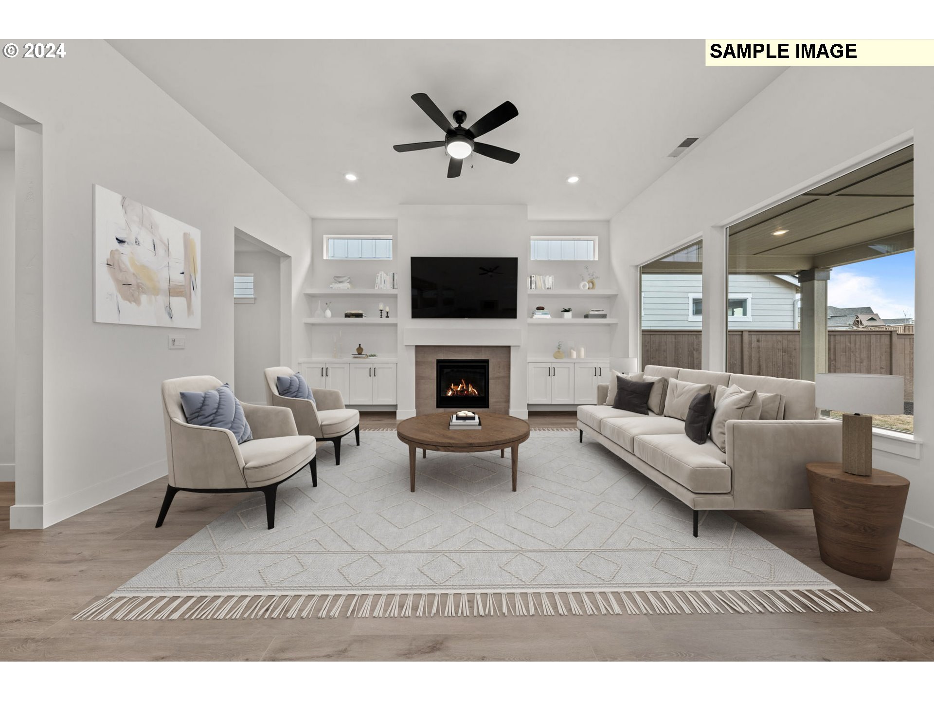 3849 South 44th Lane Ridgefield, WA 98642 - Photo 5 of 9 a living room with furniture a fireplace and a flat screen tv