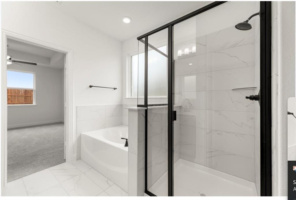 2902 Hanscom Street Forney, TX 75126 - Photo 15 of 28 Full bathroom featuring a garden tub, a marble finish shower, ceiling fan, light carpet, and light marble finish flooring