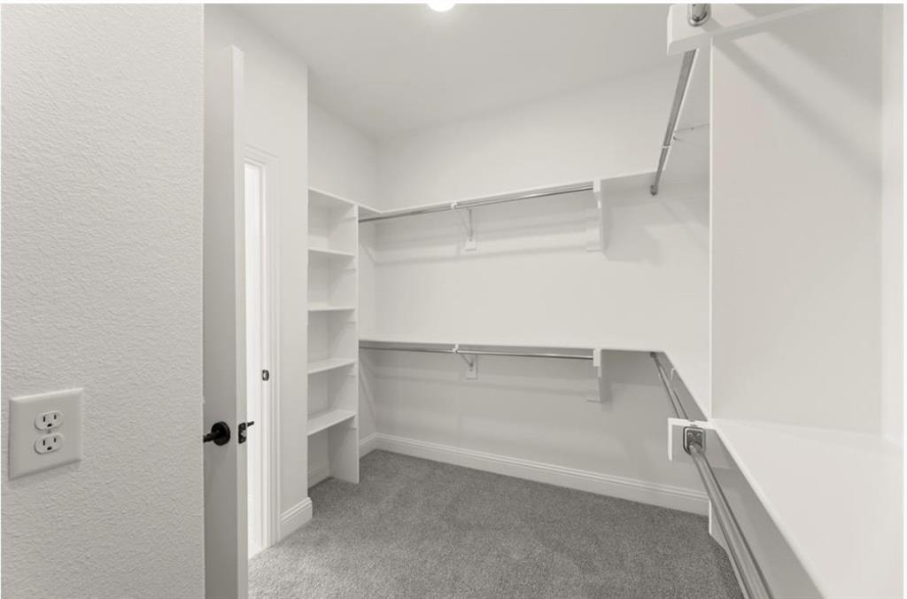 2902 Hanscom Street Forney, TX 75126 - Photo 16 of 28 Walk in closet with light colored carpet
