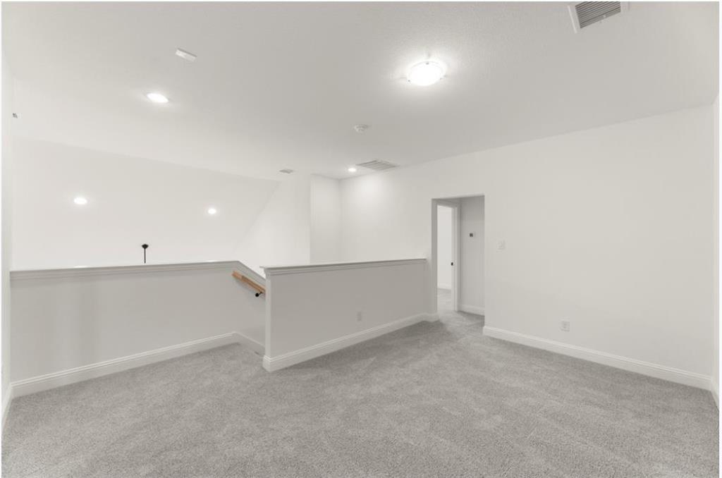 2902 Hanscom Street Forney, TX 75126 - Photo 17 of 28 Unfurnished room featuring light colored carpet and recessed lighting