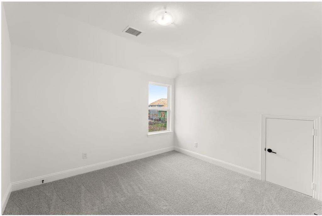 2902 Hanscom Street Forney, TX 75126 - Photo 21 of 28 Carpeted spare room with baseboards