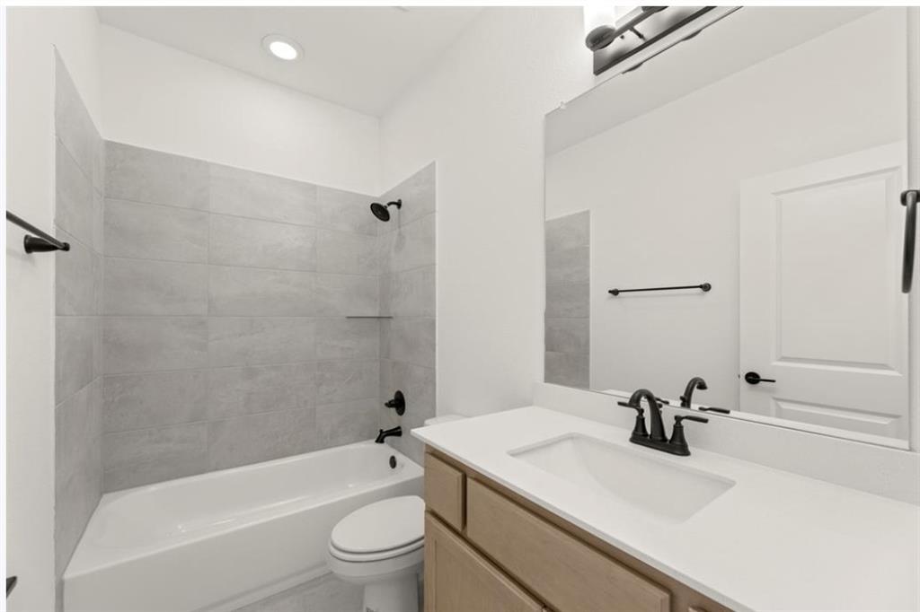 2902 Hanscom Street Forney, TX 75126 - Photo 23 of 28 Bathroom with vanity, washtub / shower combination, and recessed lighting