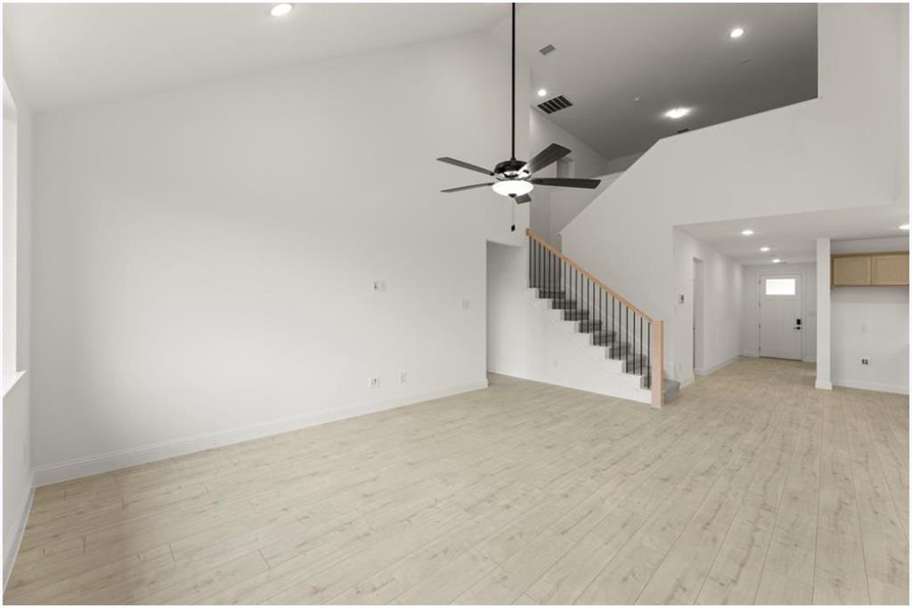 2902 Hanscom Street Forney, TX 75126 - Photo 10 of 28 Unfurnished living room featuring recessed lighting, lofted ceiling, light wood-type flooring, and ceiling fan