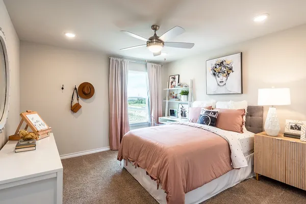 a bedroom with a large bed and a window