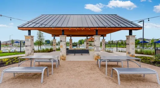 a patio with a patio table and chairs