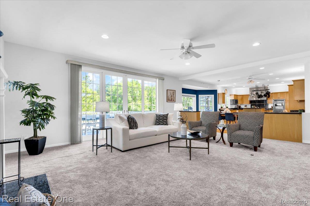 33850 Braebury Ridge Farmington, MI 48331 - Photo 11 of 85 Spacious living area featuring light gray carpeting and recessed lighting