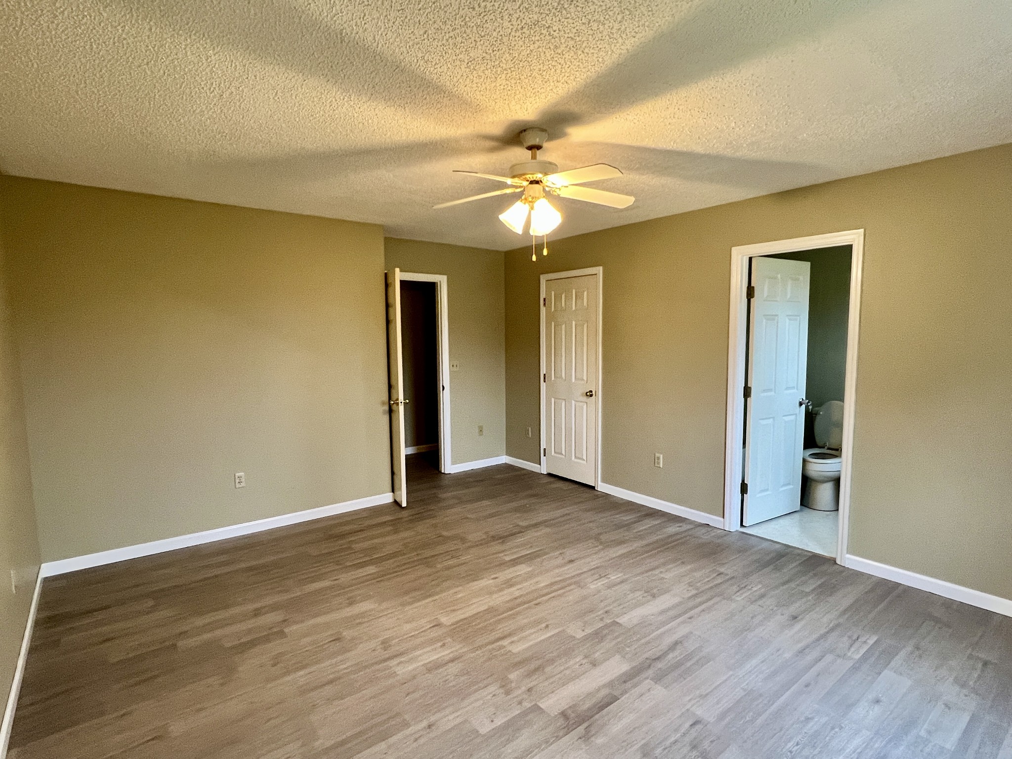 1010 Deep Draw Road Crossville, TN 38555 - Photo 17 of 33 a view of an empty room with wooden floor