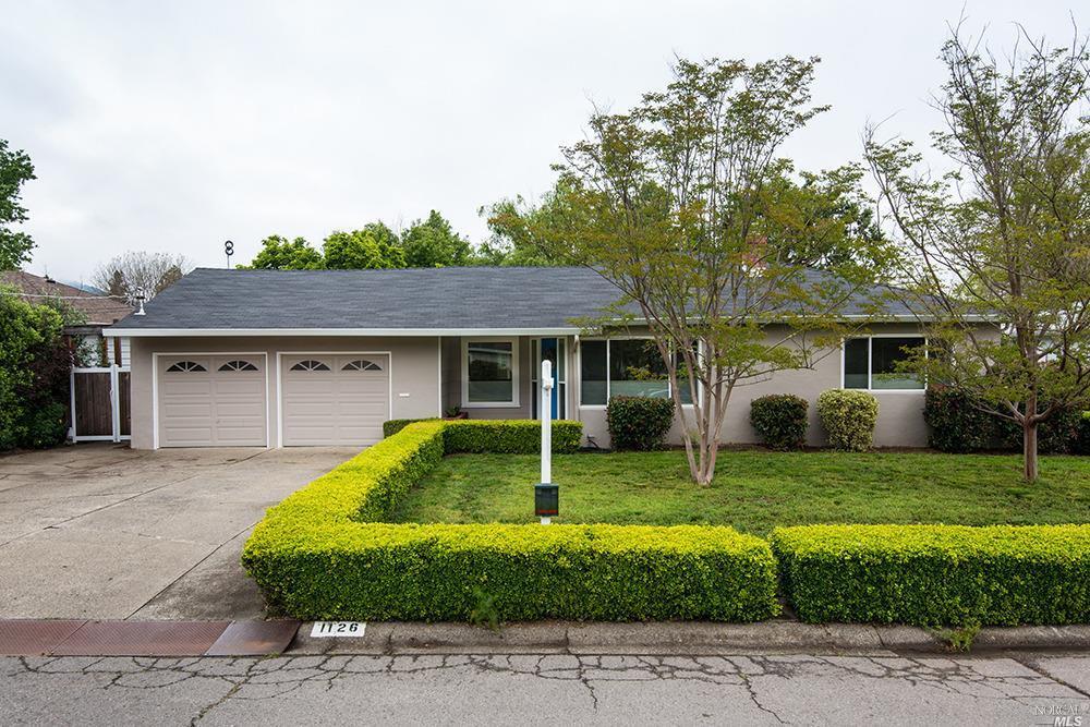 1126 Court Road Novato, CA 94945 - Photo 1 of 1 a house that has a big yard and large trees
