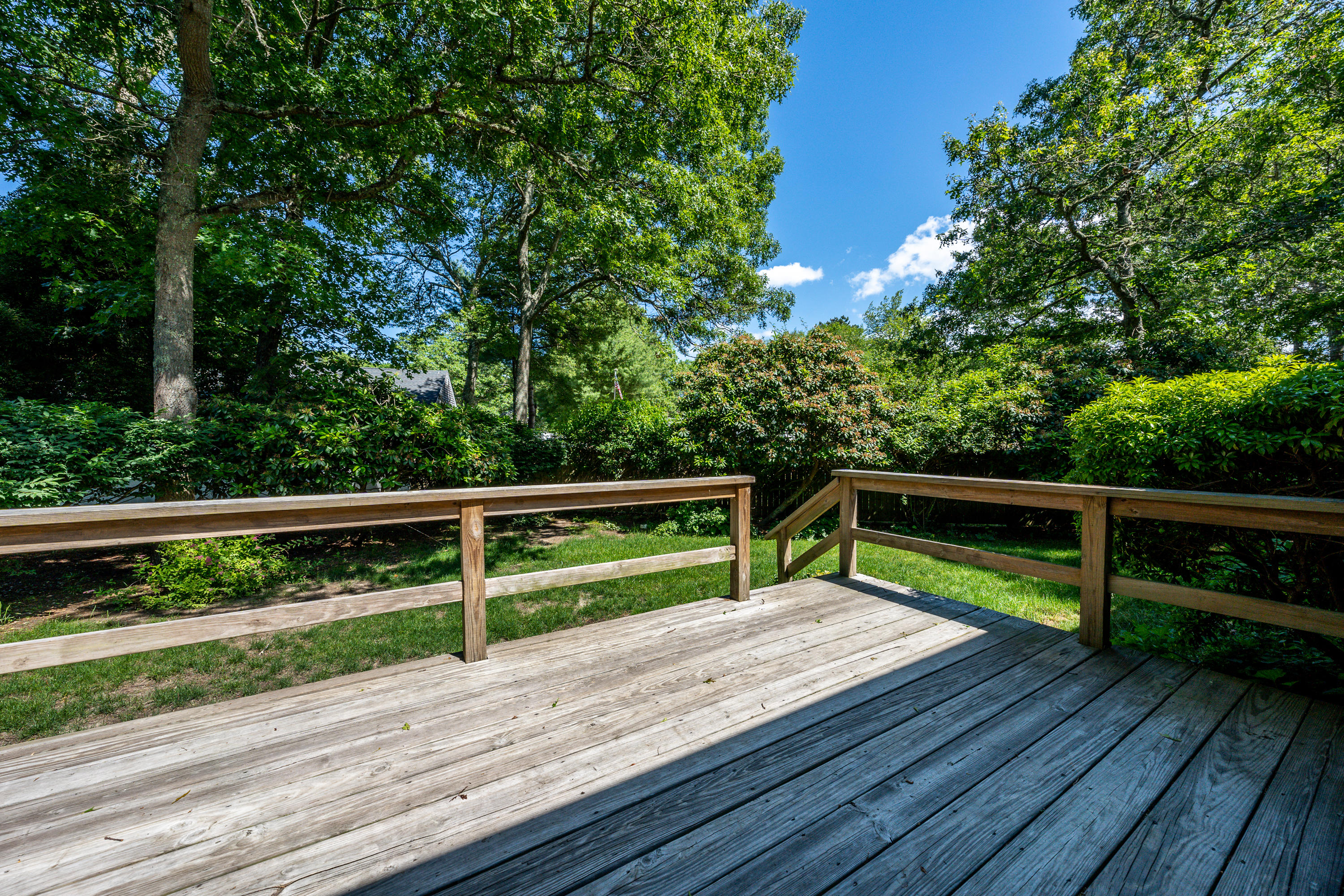 7 Rolling Hitch Road Centerville, MA 02632 - Photo 13 of 19 a view of deck with a wooden floor and fence