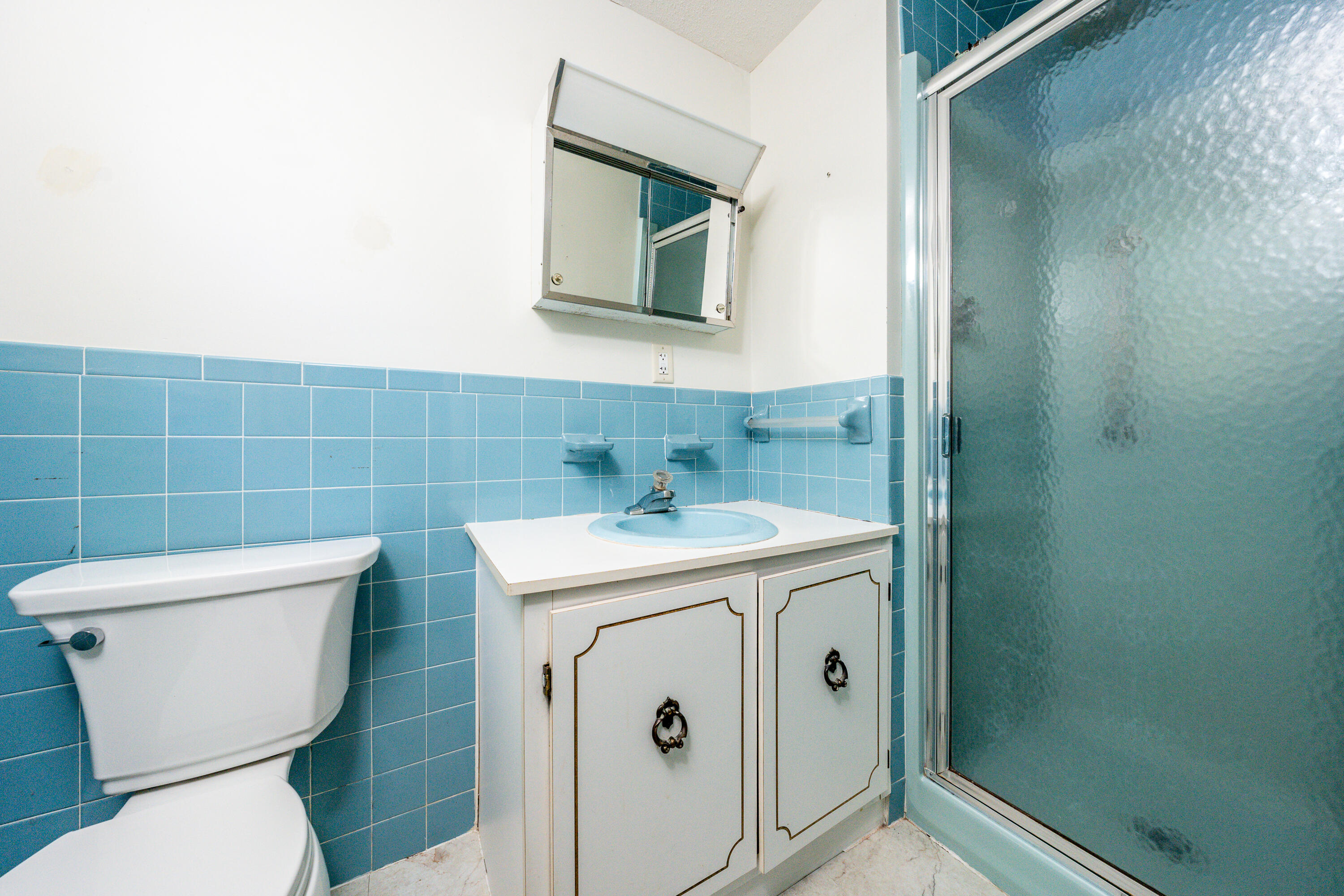 7 Rolling Hitch Road Centerville, MA 02632 - Photo 16 of 19 a bathroom with a toilet sink and mirror