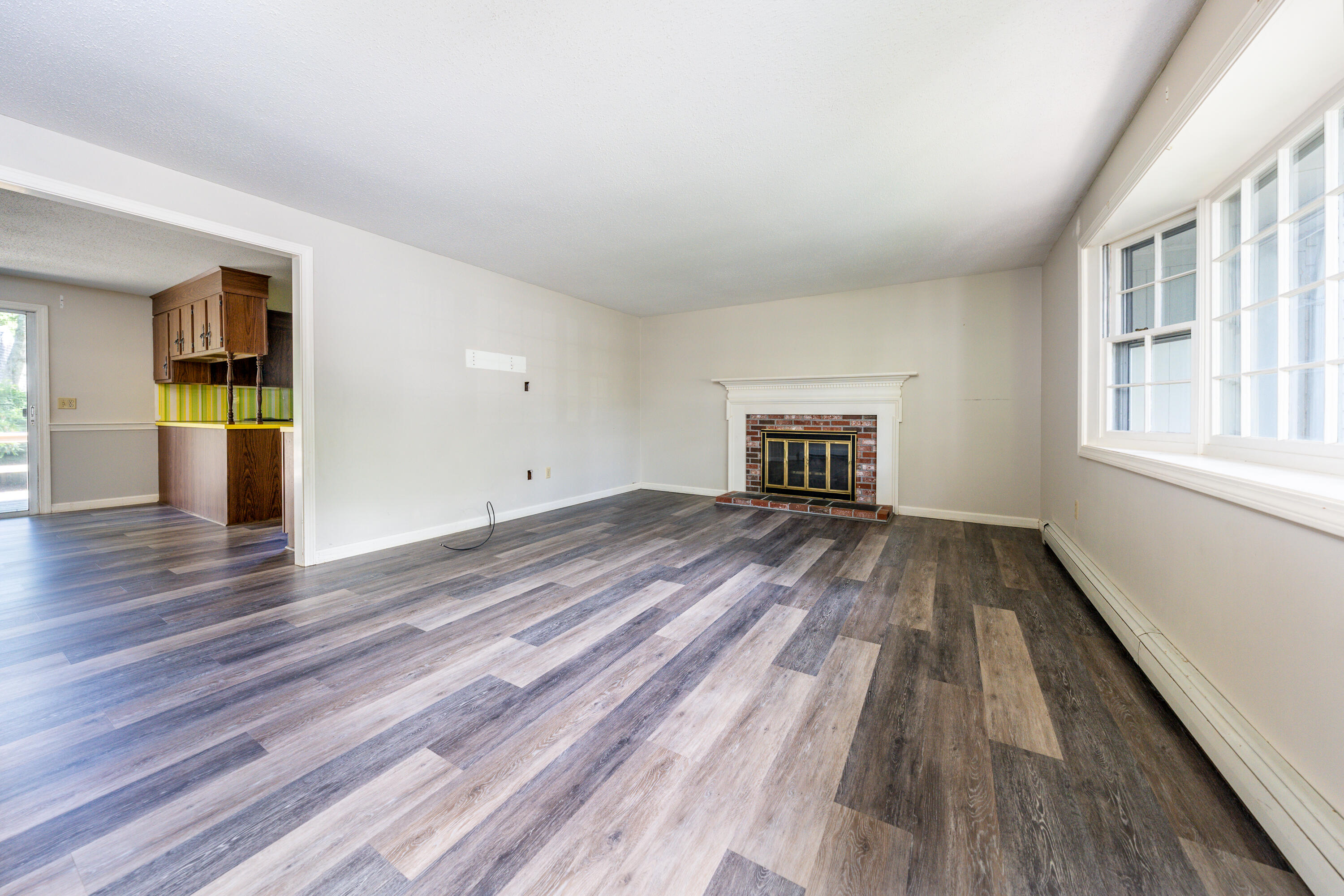 7 Rolling Hitch Road Centerville, MA 02632 - Photo 7 of 19 wooden floor in an empty room with a window
