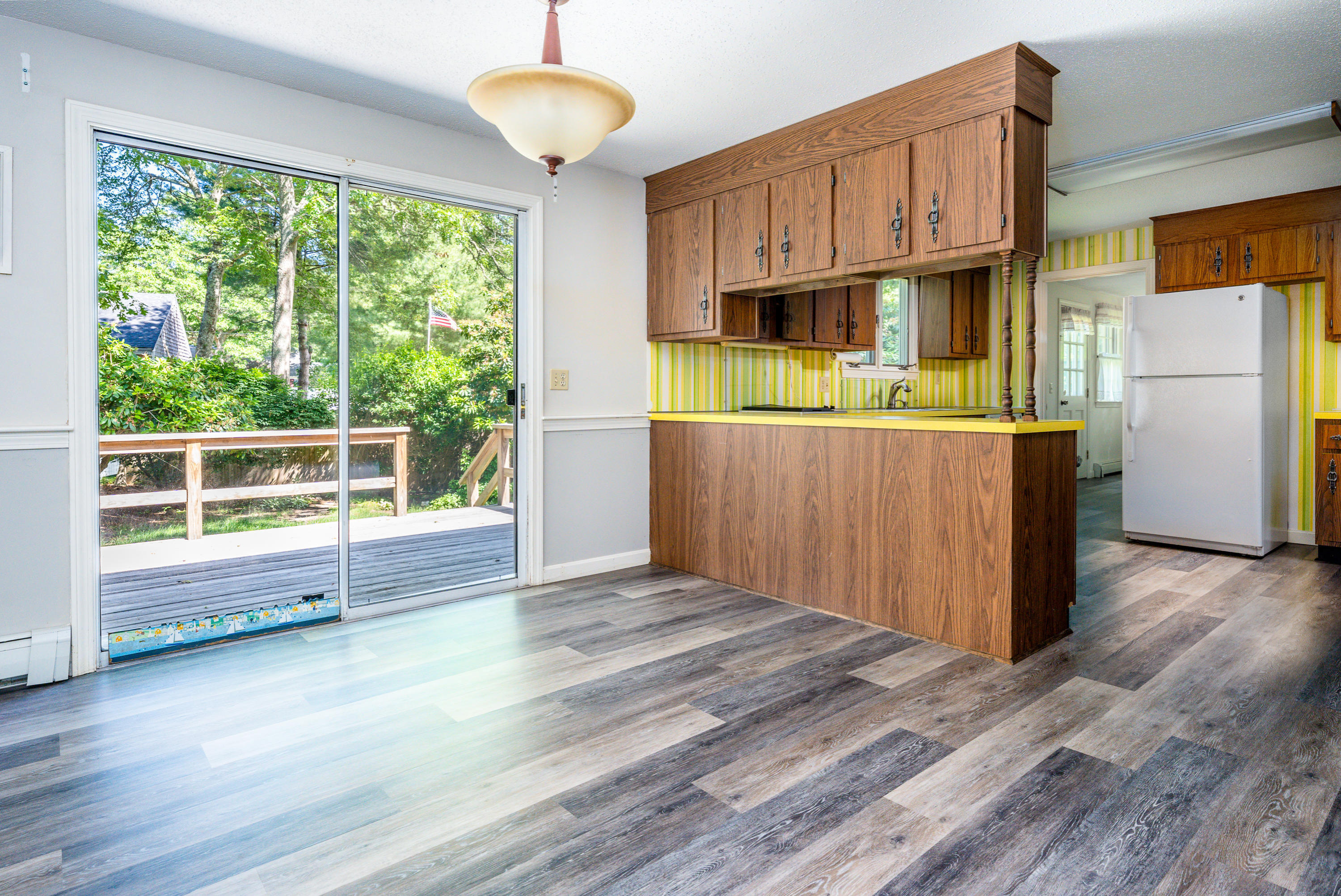 7 Rolling Hitch Road Centerville, MA 02632 - Photo 8 of 19 a view of a kitchen with wooden floor and electronic appliances
