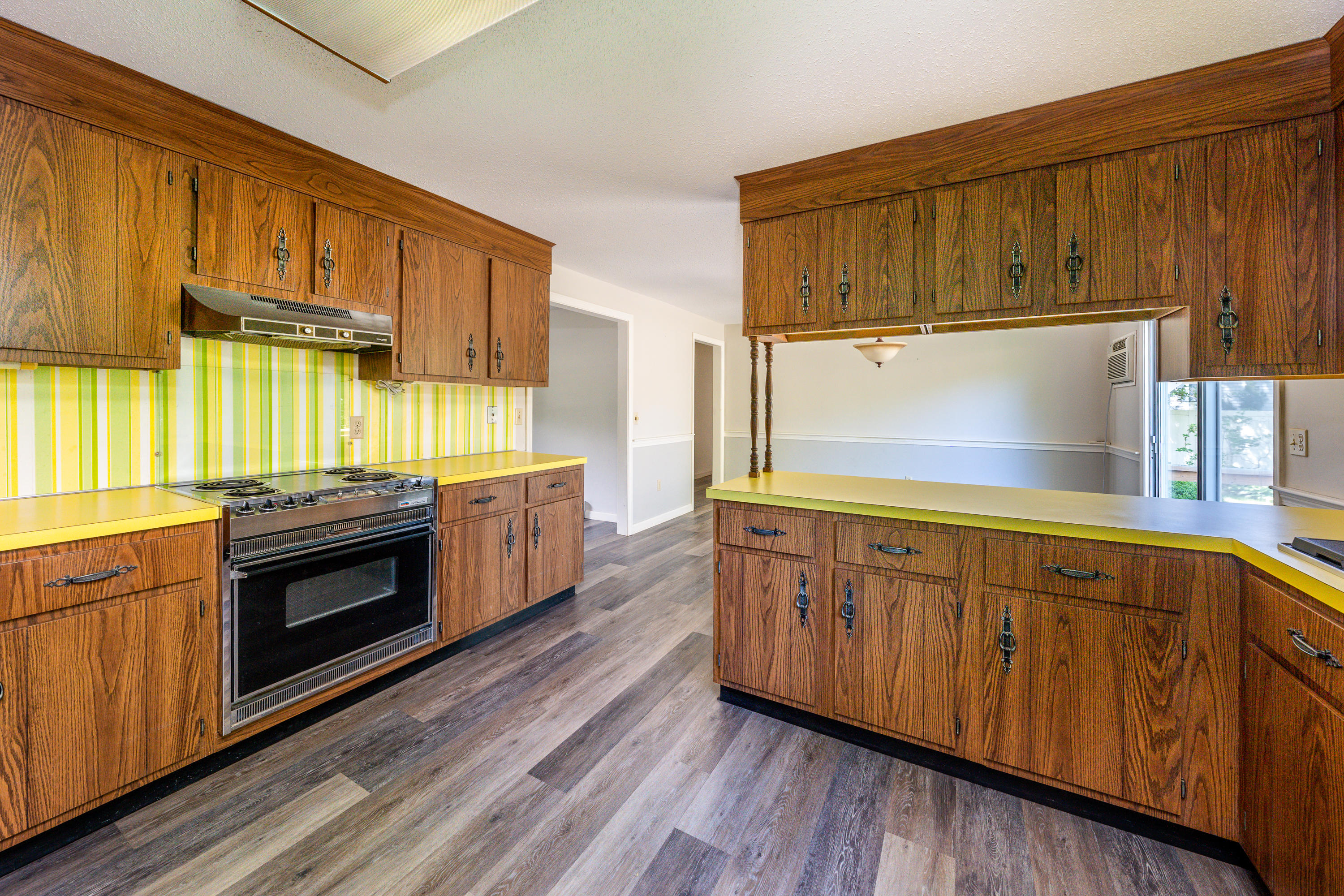 7 Rolling Hitch Road Centerville, MA 02632 - Photo 10 of 19 a kitchen with stainless steel appliances wooden cabinets and a stove top oven