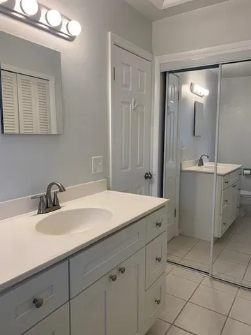 a bathroom with a sink double vanity and a mirror