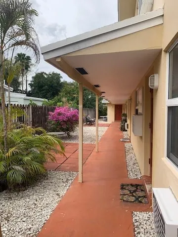 a view of swimming pool with a patio and a yard