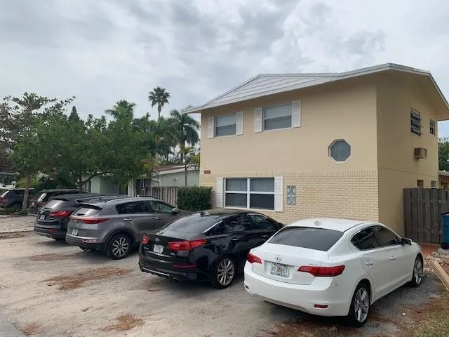 a view of a cars parked in front of a house