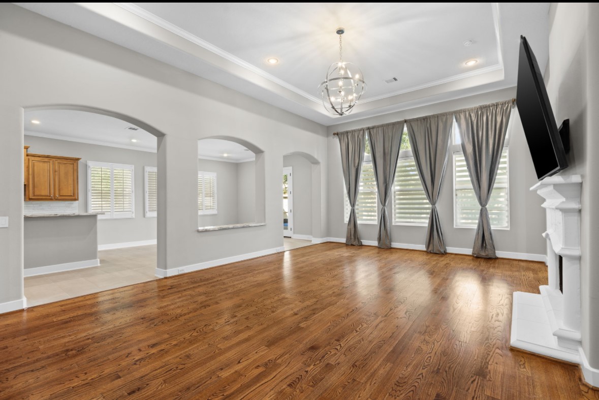 11206 Castille Lane Houston, TX 77082 - Photo 3 of 45 a view of an empty room with wooden floor and a window