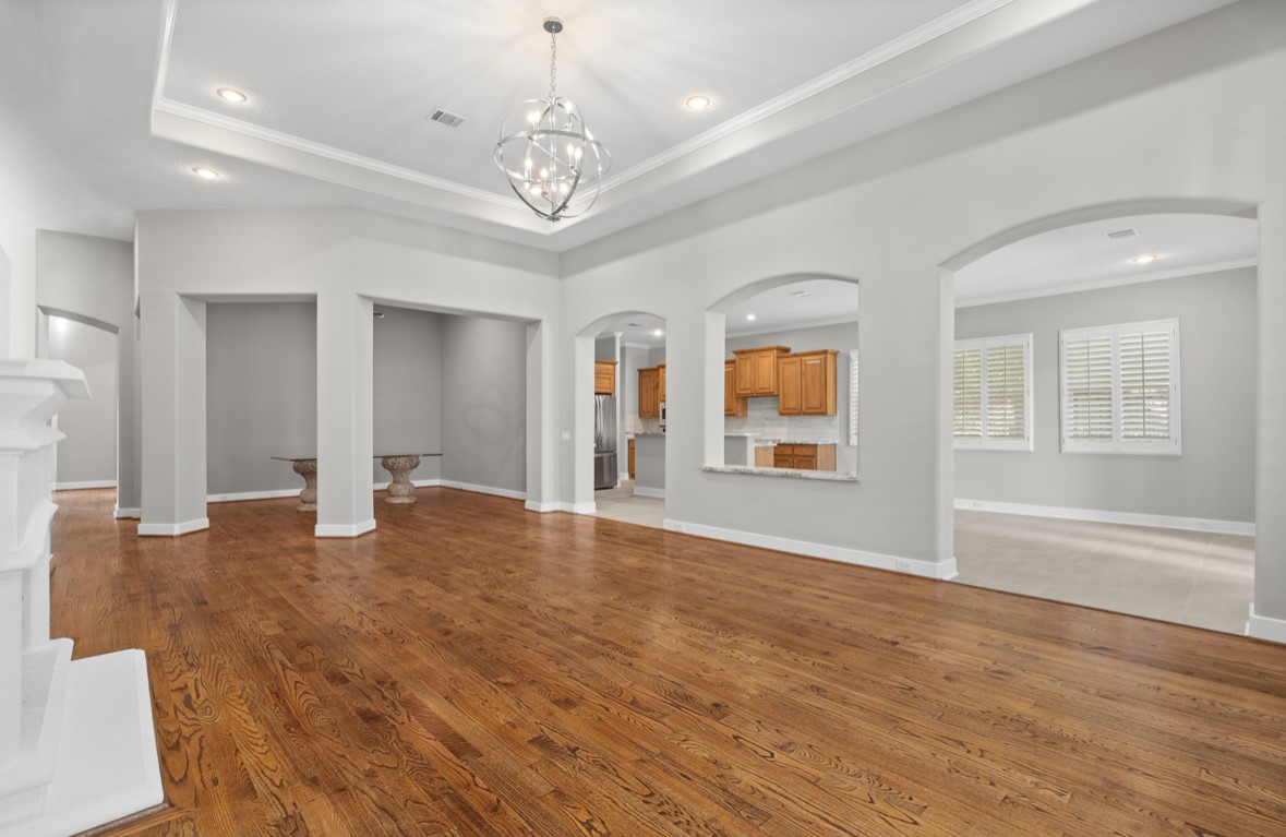 11206 Castille Lane Houston, TX 77082 - Photo 8 of 45 a view of an empty room with wooden floor and a window