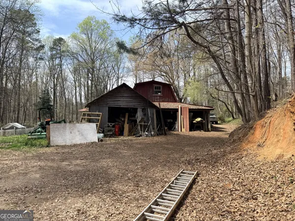 a kitchen with stainless steel appliances kitchen island granite countertop a refrigerator and microwave