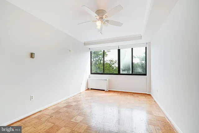 a view of an empty room with a window