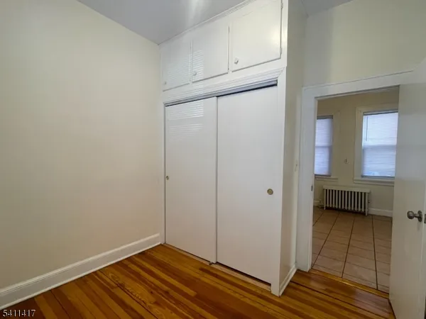 a view of bathroom with a sink and a mirror