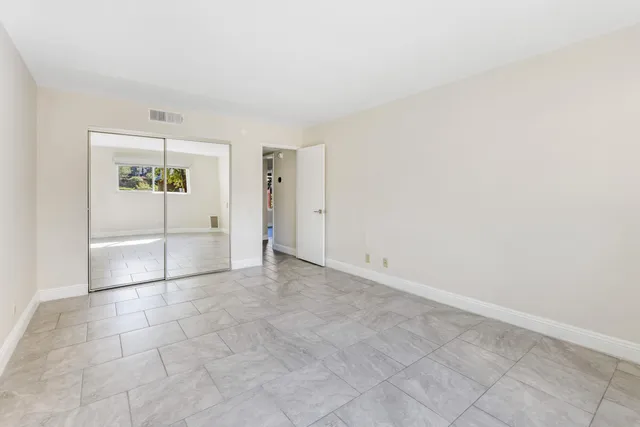 an empty room with cabinet and a projector